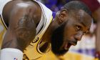 Los Angeles Lakers forward LeBron James reacts after scoring against the Cleveland Cavaliers during the first half of an NBA basketball game Sunday, Nov. 6, 2022, in Los Angeles. (AP Photo/Marcio Jose Sanchez)