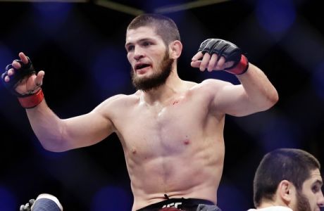 Russia's Khabib Nurmagomedov celebrates after a lightweight title bout against Al Iaquinta at UFC 223 early Sunday, April 8, 2018, in New York. Nurmagomedov won the fight. (AP Photo/Frank Franklin II)