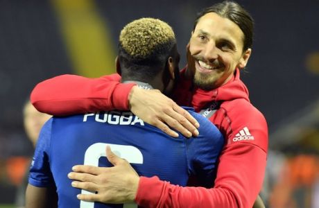United's Zlatan Ibrahimovic, right, celebrates with teammate Paul Pogba after winning the soccer Europa League final between Ajax Amsterdam and Manchester United at the Friends Arena in Stockholm, Sweden, Wednesday, May 24, 2017. United won 2-0. (AP Photo/Martin Meissner)