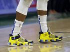The shoes of Philadelphia 76ers' Jimmy Butler are seen during the second half of an NBA basketball game against the Milwaukee Bucks Sunday, March 17, 2019, in Milwaukee. The 76ers won 130-125. (AP Photo/Aaron Gash)