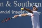 Reilly Opelka, of the United States, serves to Jo-Wilfred Tsonga, of France, on the fifth day of the Western & Southern Open tennis tournament, Wednesday, Aug. 17, 2016, in Mason, Ohio. (AP Photo/John Minchillo)