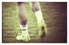 CURITIBA, BRAZIL - JUNE 09: (EDITORS NOTE: THIS IMAGES HAS BEEN CREATED WITH THE USE OF DIGITAL FILTERS)  Tattoos of the UEFA Champions League and the FIFA World Cup trophys are seen on the legs of Sergio Ramos of Spain during a Spain training session at the Centro de Entrenamiento do Caju on June 9, 2014 in Curitiba, Brazil. (Photo by David Ramos/Getty Images)