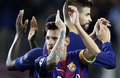 Barcelona players with Lionel Messi, center, celebrate after their 3-0 win during a Champions League group D soccer match between FC Barcelona and Juventus at the Camp Nou stadium in Barcelona, Spain, Tuesday, Sept. 12, 2017. (AP Photo/Francisco Seco)