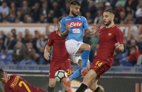 Napoli's Lorenzo Insigne, center, is challenged by Roma's Lorenzo Pellegrini, left, and Roma's Kostas Manolas during a Serie A soccer match between Roma and Napoli, at the Rome Olympic Stadium, Saturday, Oct. 14, 2017. (AP Photo/Andrew Medichini)
