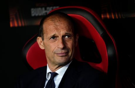 FILE - Juventus' head coach Massimiliano Allegri looks on before their Europa League soccer match against Sevilla, at the Ramon Sanchez Pizjuan stadium in Seville, Spain, Thursday, May 18, 2023. Inter Milan host Juventus on Sunday, Feb. 4, 2024. Inter coach Simone Inzaghi has won three Italian Cup titles and lifted the Italian Super Cup five times. He has never won a league title but appears to be closer than ever to it this season. Standing in his way is one of the most successful coaches in Italy in Massimiliano Allegri. (AP Photo/Jose Breton, file)