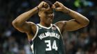 Milwaukee Bucks' Giannis Antetokounmpo reacts to a foul called against his team during the first quarter of an NBA basketball game against the Boston Celtics in Boston, Monday, Dec. 4, 2017. (AP Photo/Winslow Townson)