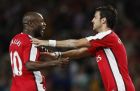Arsenal's Cesc Fabregas, right, reacts with William Gallas, after Gallas scored against FC Twente during their Champions League third qualifying round, second leg soccer match at Arsenal's Emirates Stadium in London, Wednesday, Aug. 27, 2008. (AP Photo/Kirsty Wigglesworth)