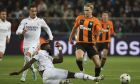 Shakhtar's Mykhaylo Mudryk, centre right, and Real Madrid's Antonio Rudiger challenge for the ball during the Champions League group F soccer match between Shakhtar Donetsk and Real Madrid at Polish Army Stadium stadium in Warsaw, Poland, Tuesday, Oct. 11, 2022. (AP Photo/Michal Dyjuk)