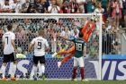 Mexico goalkeeper Guillermo Ochoa, right, jumps for the ball during the group F match between Germany and Mexico at the 2018 soccer World Cup in the Luzhniki Stadium in Moscow, Russia, Sunday, June 17, 2018. (AP Photo/Victor R. Caivano)