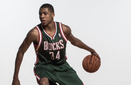 GREENBURGH, NY - AUGUST 06:  Giannis Antetokounmpo #34 of the Milwaukee Bucks poses for a portrait during the 2013 NBA rookie photo shoot at the MSG Training Center on August 6, 2013 in Greenburgh, New York.  NOTE TO USER: User expressly acknowledges and agrees that, by downloading and/or using this Photograph, user is consenting to the terms and conditions of the Getty Images License Agreement.  (Photo by Nick Laham/Getty Images)