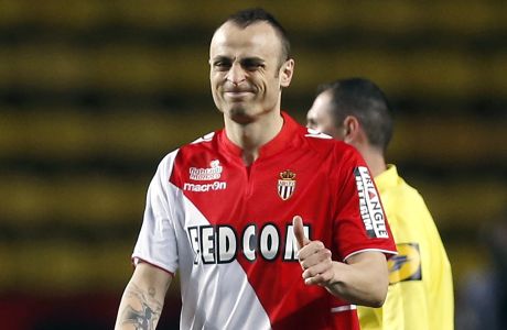 Monaco's Bulgarian forward Dimitar Berbatov celebrates after scoring a goal during the French L1 football match between AS Monaco and Sochaux at the "Louis II Stadium" in Monaco on March 9, 2014.  AFP PHOTO / VALERY HACHE        (Photo credit should read VALERY HACHE/AFP/Getty Images)