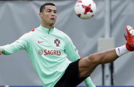 Portugal's Cristiano Ronaldo controls a ball during a training session in St.Petersburg, Russia, Monday, June 26, 2017. Portugal will play in the Confederations Cup semifinal on Wednesday. (AP Photo/Dmitri Lovetsky)