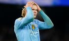 Manchester City's Erling Haaland reacts after missing a chance during the English Premier League soccer match between Manchester City and Chelsea at the Etihad stadium in Manchester, England, Saturday, Feb. 17, 2024. (AP Photo/Dave Thompson)