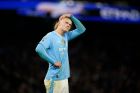 Manchester City's Erling Haaland reacts after missing a chance during the English Premier League soccer match between Manchester City and Chelsea at the Etihad stadium in Manchester, England, Saturday, Feb. 17, 2024. (AP Photo/Dave Thompson)