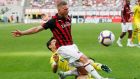 AC Milan's Ignazio Abate, top, is tackled by Chievo's Federico Barba during the Serie A soccer match between AC Milan and Chievo Verona at the San Siro Stadium, in Milan, Italy, Sunday, Oct. 7, 2018. (AP Photo/Antonio Calanni)