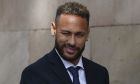 FILE - Former FC Barcelona player Neymar who now plays for Paris Saint-Germain winks as he leaves a court on the second day of a trial in Barcelona, Spain, on Oct. 18, 2022. Spain's state prosecutor dropped its charges against Neymar on Friday, but a Brazilian company involved in the case will continue to fight the soccer player in court. The case stems from Neymar's transfer in 2013 from Santos to Barcelona. The state prosecutor withdrew all charges against Neymar, his father and the former executives of the Brazilian and Spanish clubs. However, the trial will continue because Brazilian company DIS, which brought the case, maintained its accusation that the parties involved committed fraud and corruption. (AP Photo/Joan Mateu Parra)