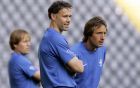Dutch soccer coach Marco van Basten, center and his assistant coaches Rob Witschge, left and John van't Schip, right, watch their players during the practice session with the Dutch national soccer team in the World Cup stadium in Frankfurt, Germany, Tuesday June 20, 2006, as part of preparations for upcoming World Cup soccer match against Argentina on Wednesday. The Netherlands will play against Argentina, Ivory Coast and Serbia and Montenegro in their Group C matches. (AP Photo/Bas Czerwinski)