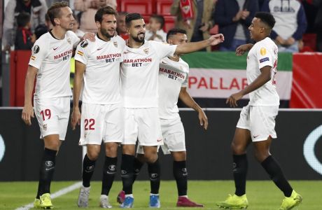 Sevilla's players celebrates after scoring their side's first goal scored by Franco Vazquez, 2nd left, during the Europa League group A soccer match between Sevilla and Dudelange at the Estadio Ramon Sanchez-Pizjuan stadium in Seville, Spain, Thursday, Oct. 24, 2019. (AP Photo/Miguel Morenatti)