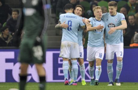 Celta's Mallo, center, reacts with teammates after team's goal during the Europa League round of 16 second leg soccer match between Krasnodar and Celta in Krasnodar, Russia, Thursday, March 16, 2017. (AP Photo/Str)
