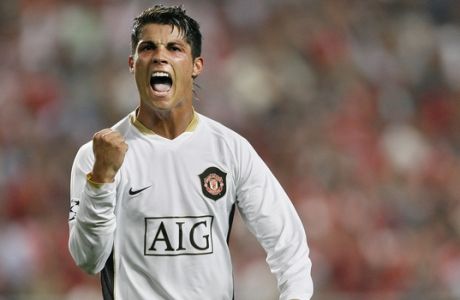 Manchester United player Cristiano Ronaldo from Portugal celebrates the goal of his teammate Louis Saha during his UEFA Champions League group F soccer match against Benfica at the Luz stadium in Lisbon, Tuesday, Sept. 26, 2006. (AP Photo/Jasper Juinen)