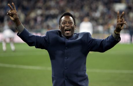 FILE - Brazil's soccer legend Pele greets the crowd ahead of a Spanish league soccer match, in the Santiago Bernabeu stadium in Madrid, Jan. 16, 2005. Pelé, the Brazilian king of soccer who won a record three World Cups and became one of the most commanding sports figures of the last century, died in Sao Paulo on Thursday, Dec. 29, 2022. He was 82.  (AP Photo/Jasper Juinen, File)