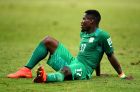 FORTALEZA, BRAZIL - JUNE 24: A dejected Serge Aurier of the Ivory Coast sits on the field after being defeated by Greece 2-1 during the 2014 FIFA World Cup Brazil Group C match between Greece and Cote D'Ivoire at Estadio Castelao on June 24, 2014 in Fortaleza, Brazil.  (Photo by Lars Baron - FIFA/FIFA via Getty Images)