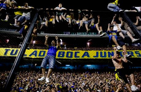 Boca Juniors' soccer fans celebrate winning Argentina's soccer league championship title after defeating Banfield 3-0 in Buenos Aires, Argentina, Sunday Dec. 4, 2011. (AP Photo/Natacha Pisarenko)