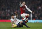 Tottenham's Jan Vertonghen, left, is challenged by Arsenal's Hector Bellerin during the English Premier League soccer match between Arsenal and Tottenham Hotspur at Emirates stadium in London, Saturday, Nov. 18, 2017. (AP Photo/Kirsty Wigglesworth)