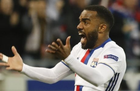 Lyon's Alexandre Lacazette reacts after his team scored their side's third goal during the second leg semi final soccer match between Olympique Lyon and Ajax in the Stade de Lyon, Decines, France, Thursday, May 11, 2017. (AP Photo/Laurent Cipriani)