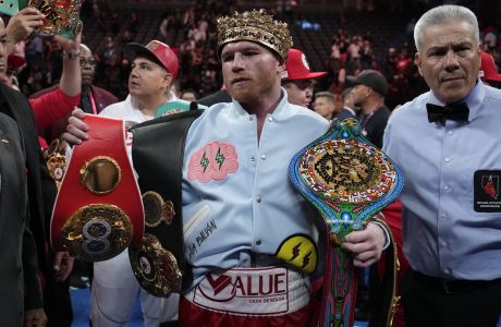 Canelo Alvarez celebrates after defeating Gennady Golovkin in their super middleweight title boxing match, Saturday, Sept. 17, 2022, in Las Vegas. (AP Photo/John Locher)