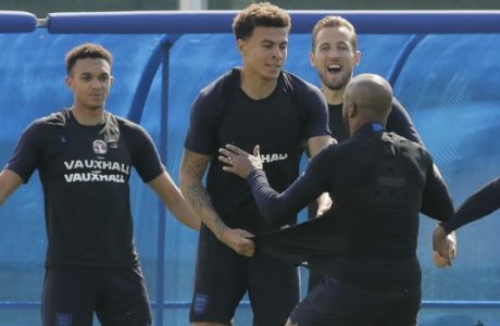 From left: Englands' Trent Alexander-Arnold, Dele Alli, Harry Kane and Fabian Delph attend England's official training in Zelenogorsk near St. Petersburg, Russia, Friday, July 13, 2018, on the eve of the third place match between England and Belgium at the 2018 soccer World Cup. (AP Photo/Dmitri Lovetsky)