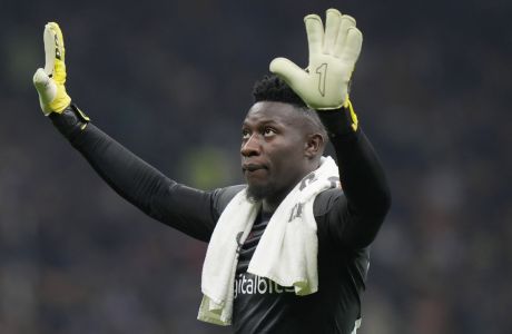 Inter Milan's goalkeeper Andre Onana gestures to supporters during a Serie A soccer match between Inter Milan and Sampdoria at the San Siro stadium in Milan, Italy, Saturday, Oct.29, 2022. (AP Photo/Luca Bruno)
