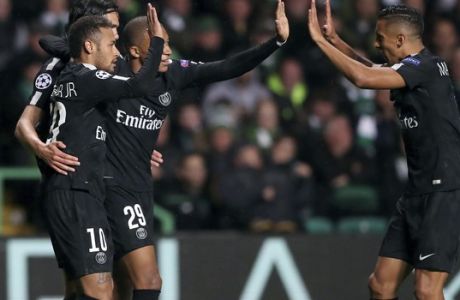 PSG's scorer Neymar, front left, and his teammates celebrate the opening goal during the Champions League Group B soccer match between Celtic and Paris St. Germain at the Celtic Park stadium in Glasgow, Scotland, Tuesday, Sept. 12, 2017. (AP Photo/Scott Heppell)