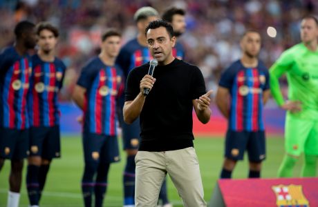 Barcelona's coach Xavi Hernandez addresses to the crowd prior of the Joan Gamper trophy soccer match between FC Barcelona and Pumas Unam at the Camp Nou Stadium in Barcelona, Spain, Sunday, Aug. 7, 2022. (AP Photo/Joan Monfort)