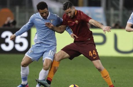 Lazio's Felipe Anderson, left, and Roma's Kostas Manolas vie for the ball during an Italian Cup, first-leg, semifinal soccer match, at the Rome Olympic stadium, Wednesday, March 1, 2017. (AP Photo/Gregorio Borgia)