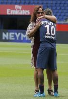 Brazilian soccer star Neymar embraces his mother following a press conference in Paris Friday, Aug. 4, 2017. Neymar arrived in Paris on Friday the day after he became the most expensive player in soccer history when completing his blockbuster transfer to Paris Saint-Germain from Barcelona for 222 million euros ($262 million).(AP Photo/Michel Euler)