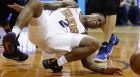 Phoenix Suns guard Isaiah Canaan injures his foot, landing awkwardly, after being fouled by the Dallas Mavericks during the first half of an NBA basketball game Wednesday, Jan. 31, 2018, in Phoenix. (AP Photo/Ross D. Franklin)