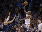 Phoenix Suns forward P.J. Tucker, right, shoots in front of Oklahoma City Thunder center Enes Kanter, left, and guard Anthony Morrow (2) in the second quarter of an NBA basketball game in Oklahoma City, Thursday, Dec. 31, 2015. (AP Photo/Sue Ogrocki)
