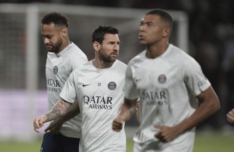 From left to right, PSG's players Neymar, Lionel Messi and Kylian Mbappe, warm up before the group H Champions League soccer match between Maccabi Haifa and Paris Saint-Germain in Haifa, Israel, Wednesday, Sept. 14, 2022. (AP Photo/Ariel Schalit)