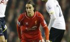Liverpool's Lazar Markovic, center, is challenged for the ball by Tottenham's Harry Kane and Christian Eriksen, right, during the English Premier League soccer match between Liverpool and Tottenham Hotspur at Anfield Stadium, Liverpool, England, Tuesday Feb. 10, 2015. (AP Photo/Jon Super)