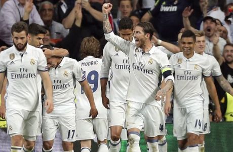 Real Madrid players celebrate after scoring their third goal during the Champions League semifinals first leg soccer match between Real Madrid and Atletico Madrid at Santiago Bernabeu stadium in Madrid, Spain, Tuesday May 2, 2017. (AP Photo/Daniel Ochoa de Olza)