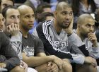 FILE - This Jan. 22, 2011 file photo shows San Antonio Spurs, from left,  guard Manu Ginobili, of Argentina, Richard Jefferson, Tim Duncan and Tony Parker, of France, watching action from the bench in the second half of an NBA basketball game against the New Orleans Hornets in New Orleans. The Spurs played without Duncan, Parker, Ginobili and Danny Green Thursday night, Nov. 29, 2012 against the Miami Heat in Miami, all sent back to San Antonio by coach Gregg Popovich, who said the move was in his team's best interest. NBA Commissioner David Stern called the decision "unacceptable," apologizing to fans and saying that sanctions against the Spurs will be forthcoming. (AP Photo/Patrick Semansky, FIle)