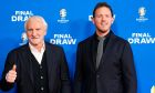 FILE - Rudi Voeller, left, director of the Germany national soccer team and Germany's head coach Julian Nagelsmann, right, arrive for the draw for the UEFA Euro 2024 soccer tournament in Hamburg, Germany, Saturday, Dec. 2, 2023. Rudi Völler is set to stay on as sporting director of the German mens national soccer team through to the 2026 World Cup. (AP Photo/Martin Meissner, File)