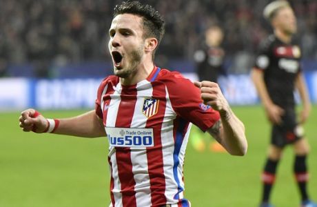 Atletico's Saul Niguez celebrates after scoring the opening goal during the Champions League round of 16 first leg soccer match between Bayer Leverkusen and Atletico Madrid in Leverkusen, Germany, Tuesday, Feb. 21, 2017. (AP Photo/Martin Meissner)