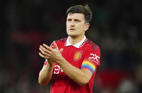 Manchester United's Harry Maguire applauds fans at the end of the English Premier League soccer match between Manchester United and West Ham United at Old Trafford stadium in Manchester, England, Sunday, Oct. 30, 2022. (AP Photo/Jon Super)
