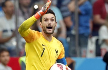France goalkeeper Hugo Lloris, left, gives instructions to his players during the quarterfinal match between Uruguay and France at the 2018 soccer World Cup in the Nizhny Novgorod Stadium, in Nizhny Novgorod, Russia, Friday, July 6, 2018. (AP Photo/Ricardo Mazalan)