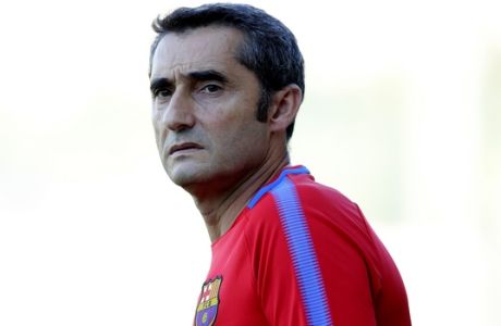 FC Barcelona's coach Ernesto Valverde looks on during a training session at the Sports Center FC Barcelona Joan Gamper in Sant Joan Despi, Spain, Saturday, Aug. 12, 2017. FC Barcelona will play against Real Madrid in the first leg of Spanish Supercup next Sunday. (AP Photo/Manu Fernandez)