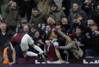 West Ham United's Marko Arnautovic celebrates with supporters after scoring his side's opening goal during the English Premier League soccer match between West Ham United and Chelsea at the London stadium in London, Saturday, Dec. 9, 2017. (AP Photo/Alastair Grant)