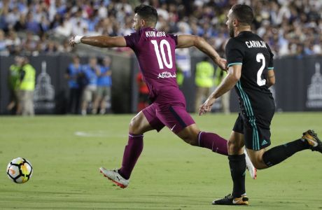 Manchester City's Sergio Aguero moves the ball past Real Madrid's Daniel Carvajal, right, during an International Champions Cup soccer match Wednesday, July 26, 2017, in Los Angeles. (AP Photo/Jae C. Hong)