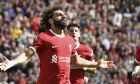 Liverpool's Mohamed Salah, left, celebrates after scoring his sides second goal during the Premier League soccer match between Liverpool and AFC Bournemouth at Anfield, in Liverpool, England, Saturday, Aug. 19, 2023. (AP Photo/Rui Vieira)